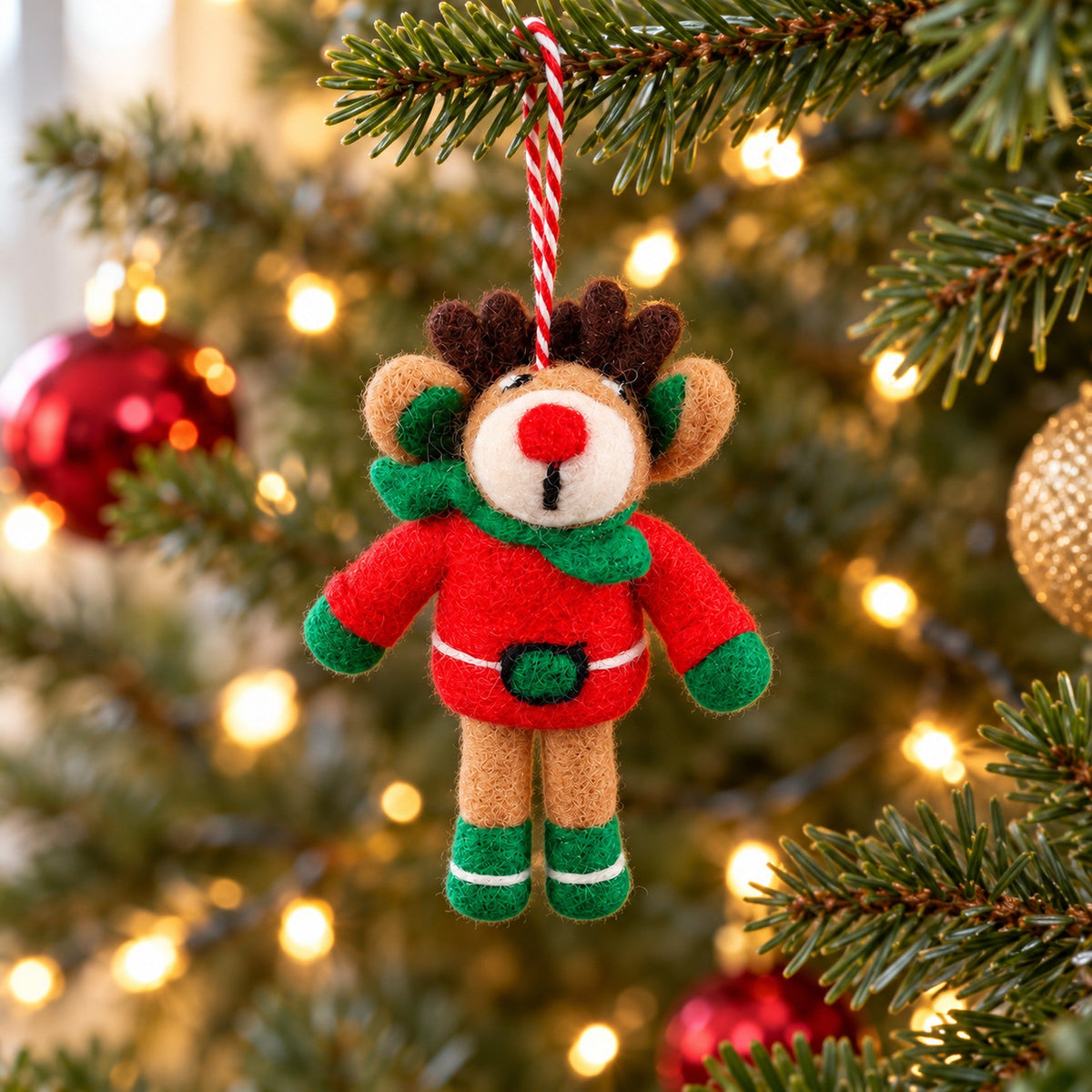 Christmas Jumper Reindeer hanging on a shared Christmas tree with space around it for other housemates' favourite decorations.